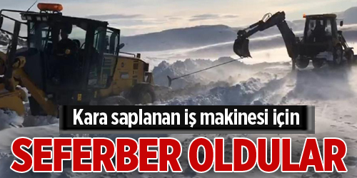 Yol açmaya giden greyder fırtınada kara saplandı